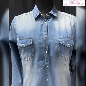Denim shirt with fancy white tap buttons along with a washed out finish.